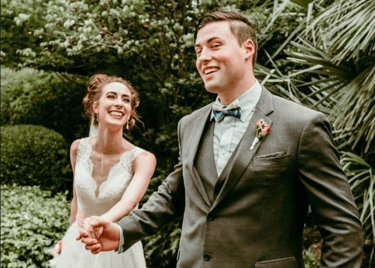 Happy couple holding hands and running
